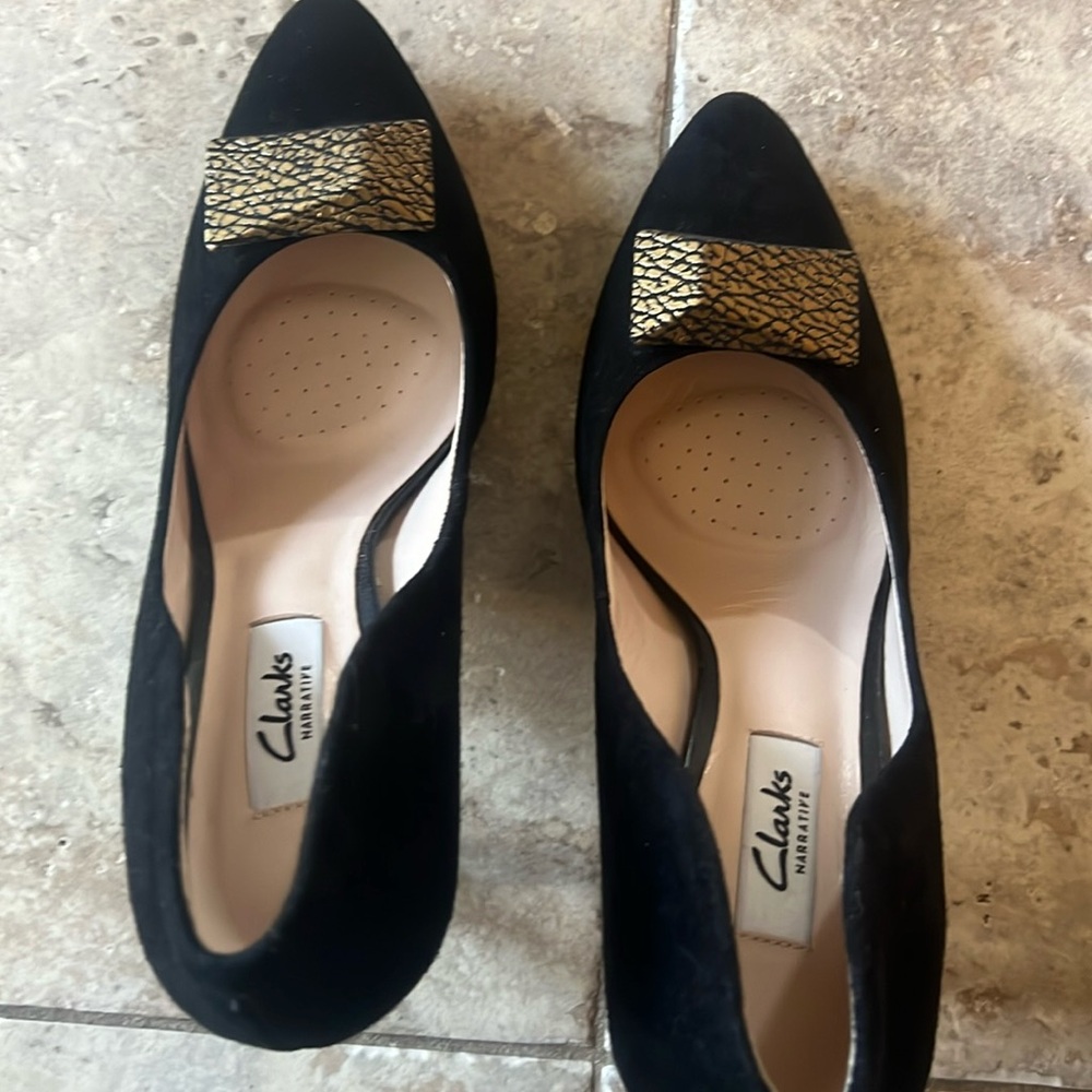 Black pumps with fancy Gold heels with padded footbed and gold trim.